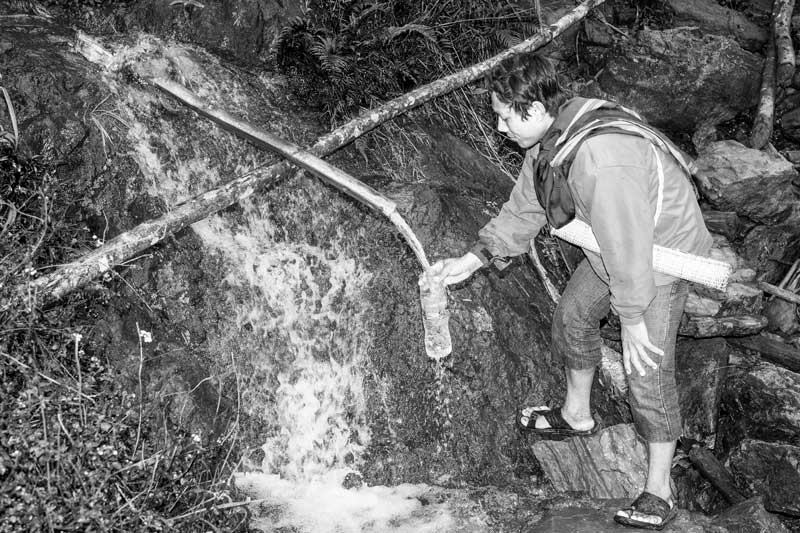 Varied drinking water sources in India - In the North-Eastern states, springs along hillslopes are transformed into drinking water sources using bamboo pipes – district West Siang, Arunachal Pradesh